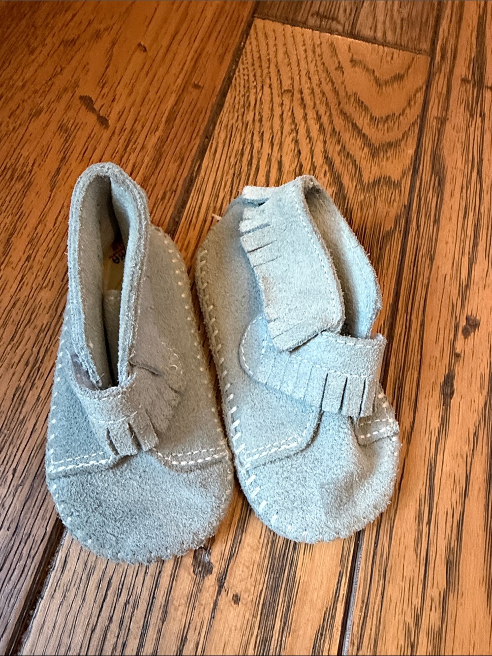 Minnetonka Kids Suede Fringe Moccasins in Light Gray